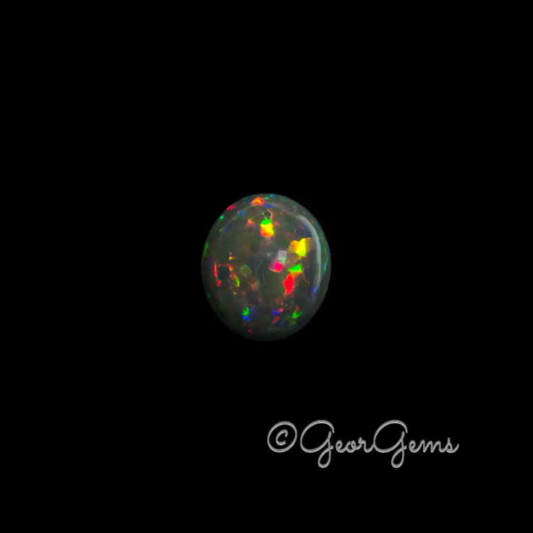 28017 9.49ct Black Opal - Oval Cabochon