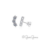 Sterling silver moissanite trio earrings with 3.5mm round stones in crescent design