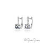 Sterling silver moissanite huggie hoop earrings with central stone and pavé detail