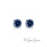 Pair of 4mm blue sapphire round studs in 4-claw 9k white gold setting, front view