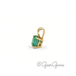 Side view of a 5.5mm emerald pendant in 9k yellow gold