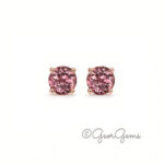 Pair of round pink tourmaline stud earrings set in 9k rose gold four-prong settings