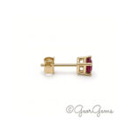 Side view of 9kt yellow gold oval ruby stud earrings, 5x4mm