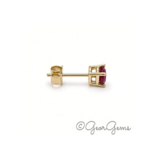Side view of 9kt yellow gold oval ruby stud earrings, 5x4mm